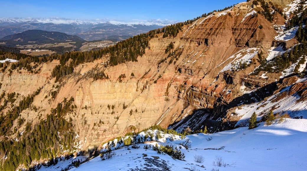 A snow-covered mountain with a clear sky.