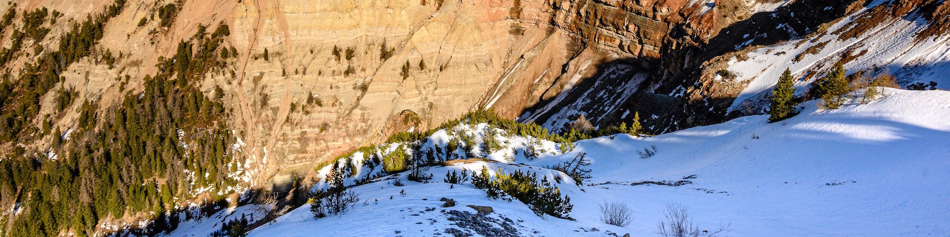 A snow-covered mountain with a clear sky.