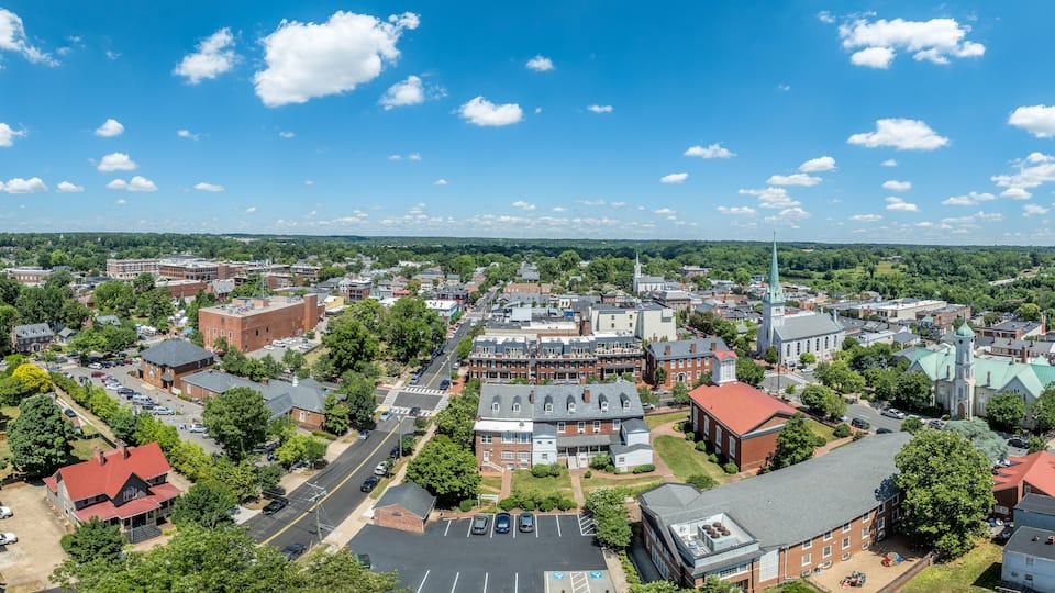 Aerial view Fredericksburg Virginia with Circuit Court building , historic business district, Baptist church, Chatham bridge over Rappahannock River