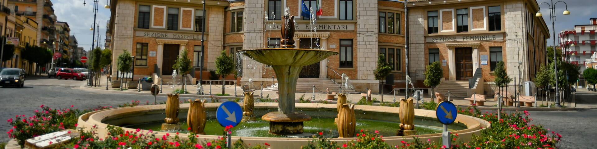 A square with the buildings of a primary school in Lavello, an old town in the Basilicata region.