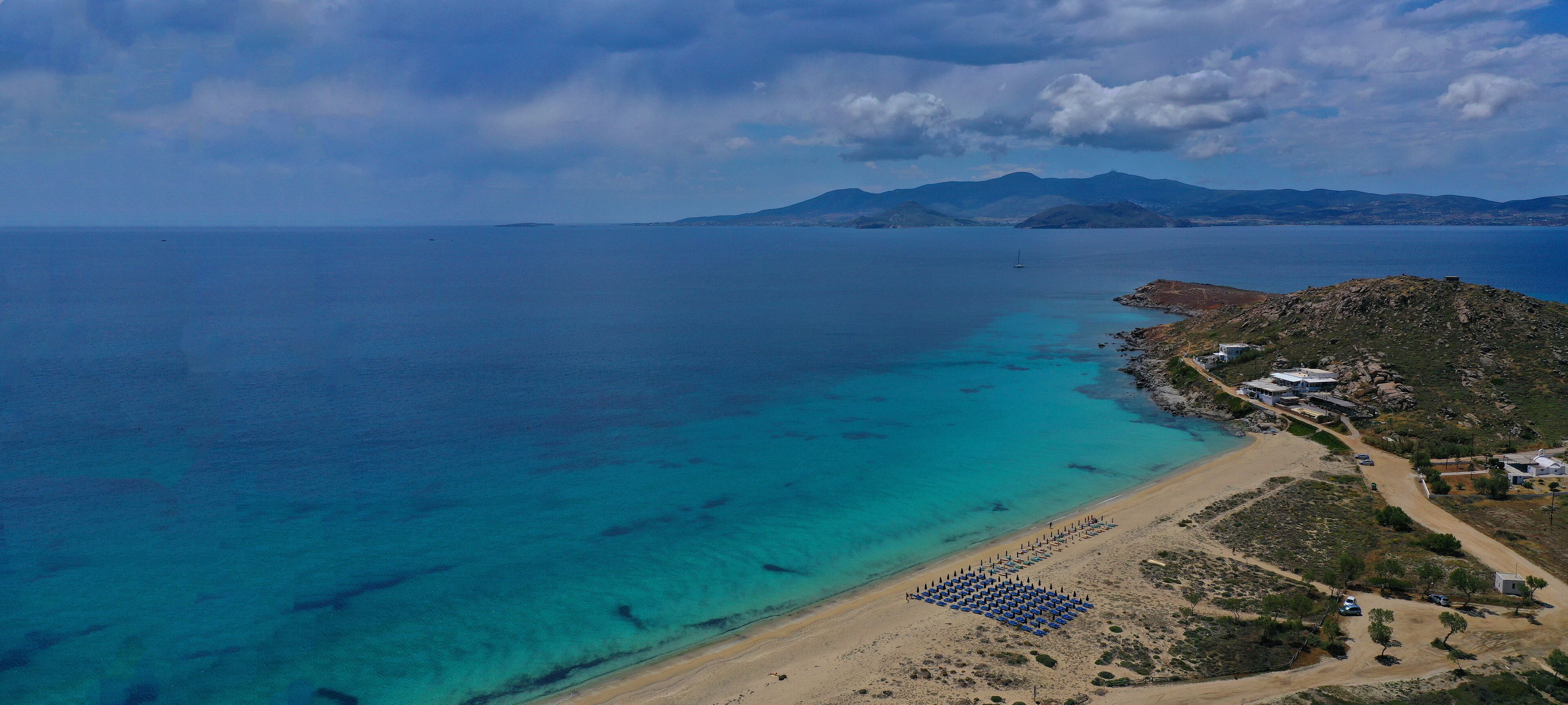 Aerial drone photo of beautiful and popular beach of Agia Anna in Naxos island, Cyclades, Greece