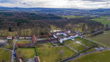 Aerial view of the old Schloss Fasanerie Engelhelms, Künzell in Germany on a sunny afternoon in autumn