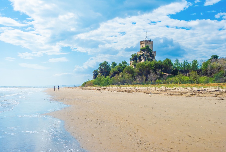 Pineto (Italy) - The touristic sandy beach of Abruzzo with the monumental pine forest and the famous tower castle called Torre di Cerrano