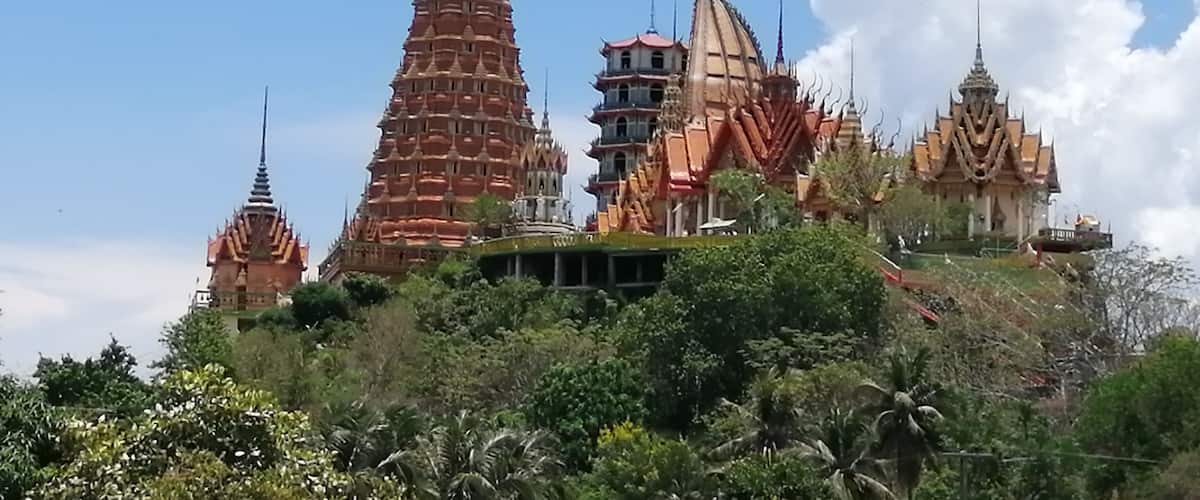 Wat Tham Suea sits on top of a hill surrounded by rice fields overlooking the River Kwai. We rented a motorbike for the day and drive out here from our guesthouse. It was well worth the drive. There are beautiful paintings, a giant Buddha, and gorgeous views.