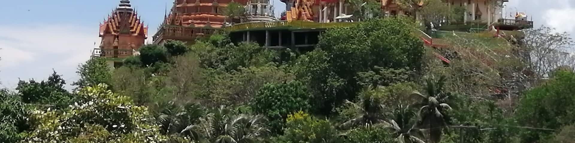 Wat Tham Suea sits on top of a hill surrounded by rice fields overlooking the River Kwai. We rented a motorbike for the day and drive out here from our guesthouse. It was well worth the drive. There are beautiful paintings, a giant Buddha, and gorgeous views.