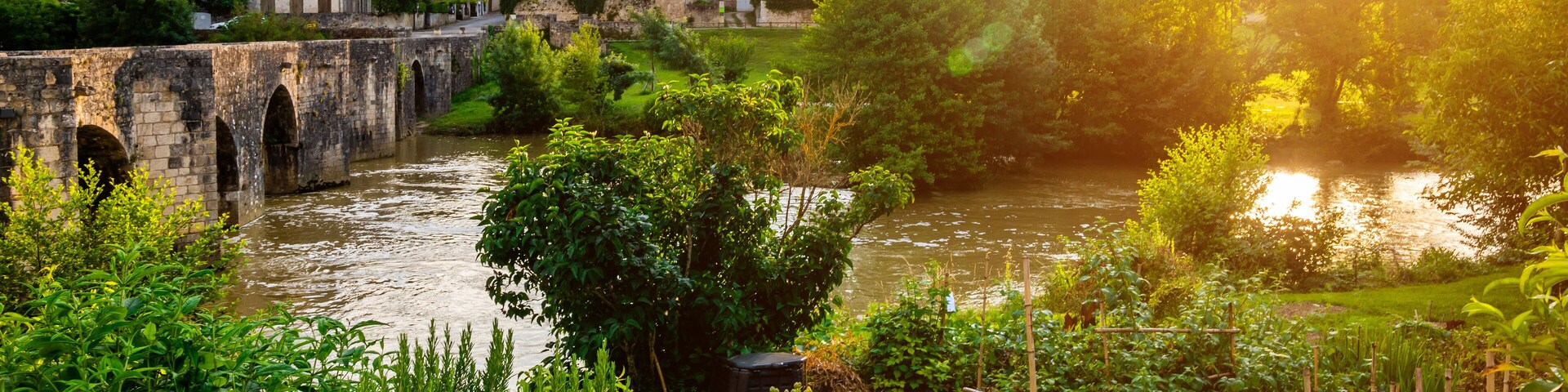 Medieval bridge and Barbaste village on background