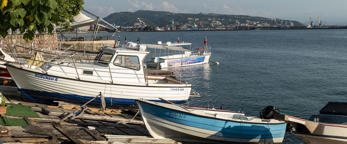 Zonguldak eregli district, fishing boats and erdemir iron and steel factory behind