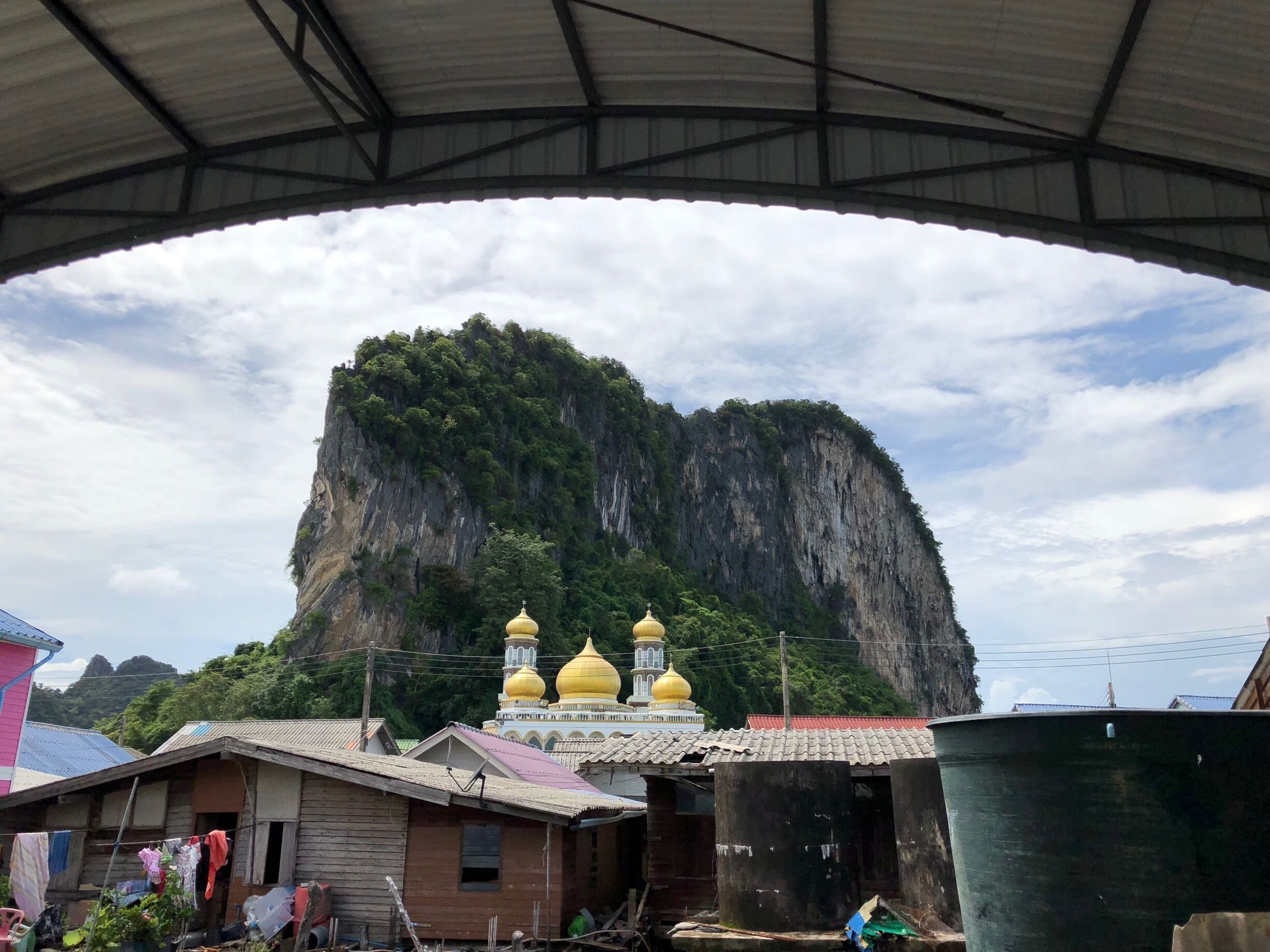 A mountain with a temple in the background.