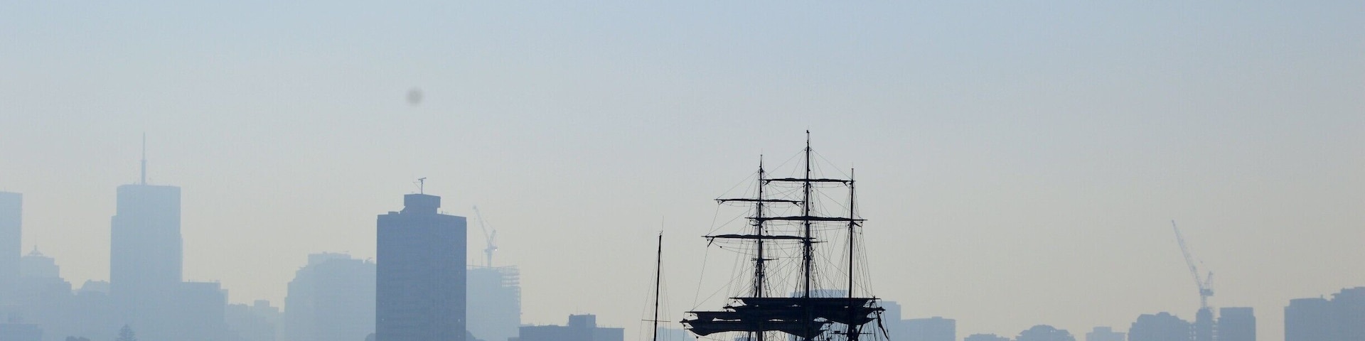 The City of Sydney was a haze of blue today 22/5/16.  
Just like ghost city.  The buildings were covered with a haze of smoke giving it a blue outline.  
The old replica Endeavour out on the water giving it a pirate feel.
#Blue