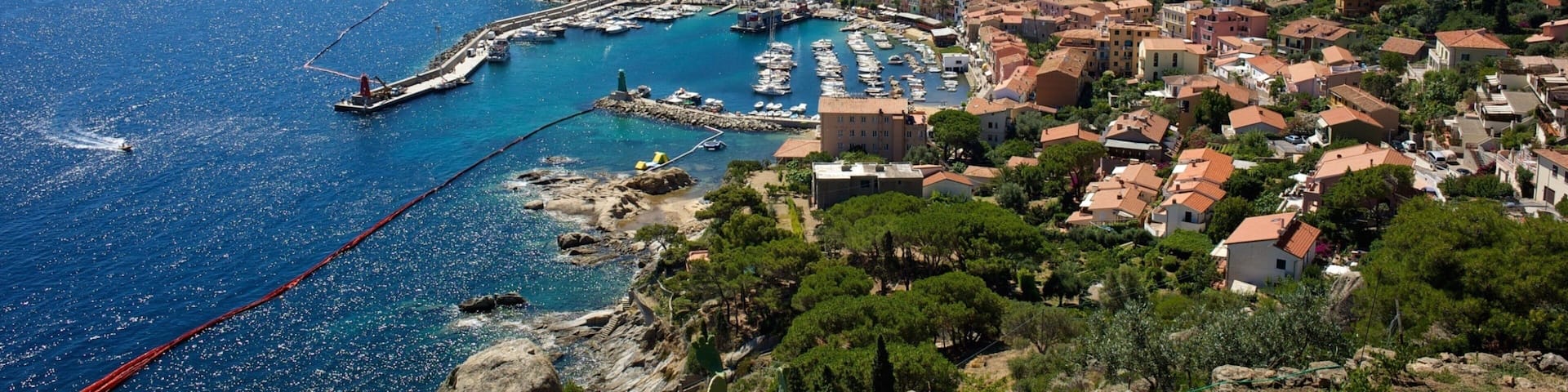 Isola del Giglio featuring a small town or village, a coastal town and general coastal views