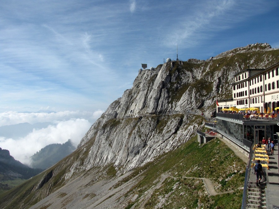 Mount Pilatus near Lucerne, Switzerland. Day trips are available from Lucerne that start with a scenic boat ride across Lake Lucerne followed by a trip to the top of Mount Pilatus via a cogwheel railway. The mountain offers many other options for recreation and scenery including gondola rides to the bottom, hiking trails atop the summit, and an aerial obstacle park in the treetops.