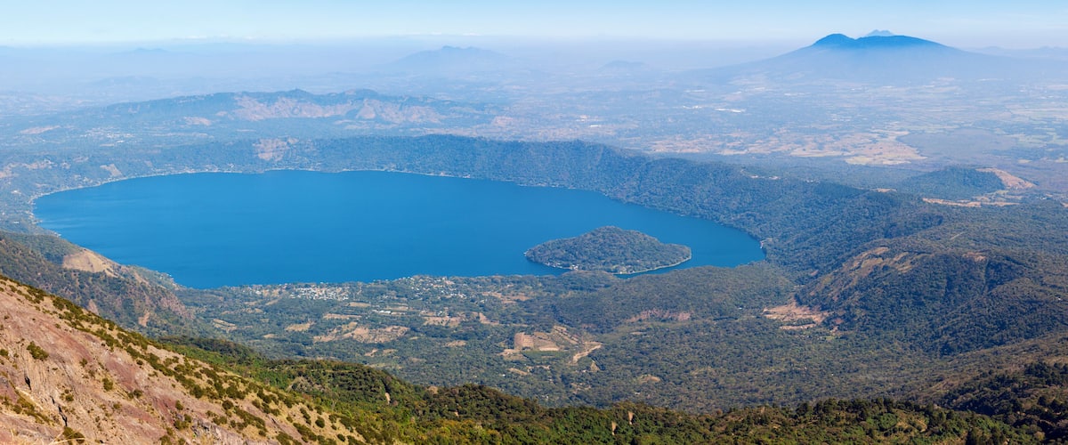A large lake surrounded by mountainous terrain.