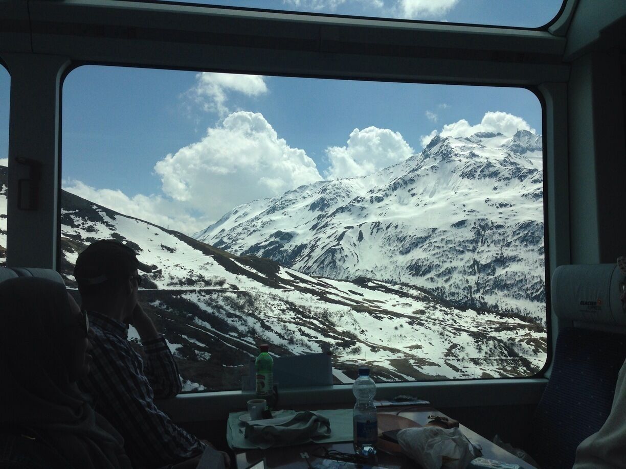#TroveOn The view from my seat on the Glacier Express, a train that starts in St. Moritz and winds through the Swiss Alps until it reaches the small skiing village of Zermatt. The GA is an all-day affair. The train moves slowly so that you have plenty of time to enjoy the views, and you're served a three-course lunch at your seat. #TroverDetour
