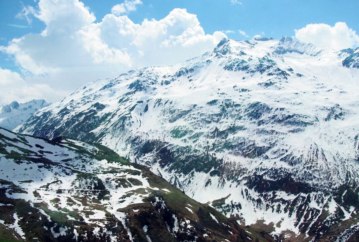 A photo of the Swiss Alps snapped from the Glacier Express, a train that starts in St. Moritz and winds through the Swiss Alps until it reaches the small skiing village of Zermatt. The GA is an all-day affair. The train moves slowly so that you have plenty of time to enjoy the views, and you're served a three-course lunch at your seat. #TroverDetour