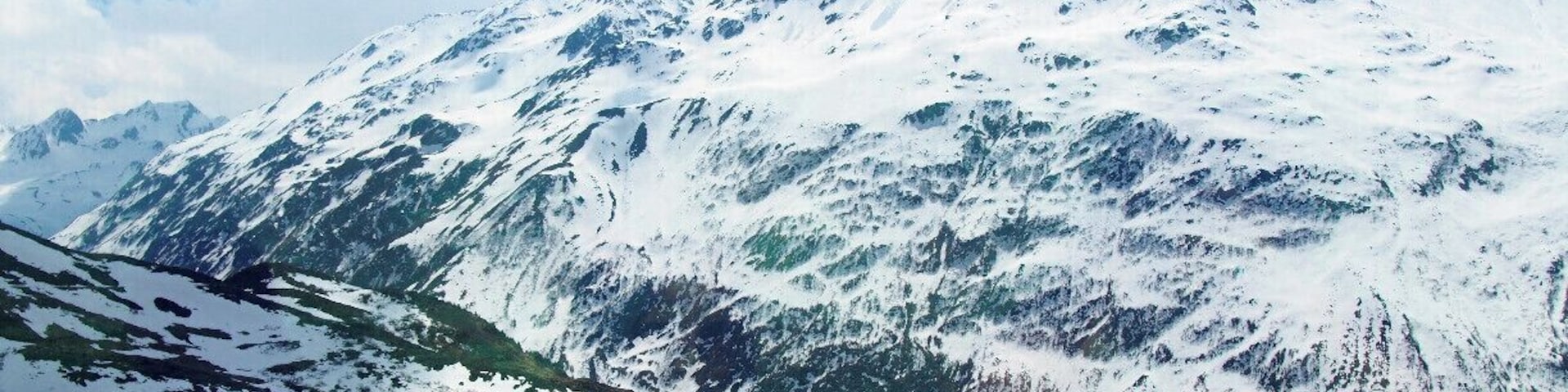 A photo of the Swiss Alps snapped from the Glacier Express, a train that starts in St. Moritz and winds through the Swiss Alps until it reaches the small skiing village of Zermatt. The GA is an all-day affair. The train moves slowly so that you have plenty of time to enjoy the views, and you're served a three-course lunch at your seat. #TroverDetour