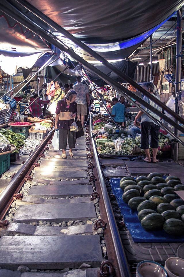 I was infatuated with this tiny elderly asian woman shopping around the Mae Klong Railway Station.  Just so photogenic..

#SpringFun
