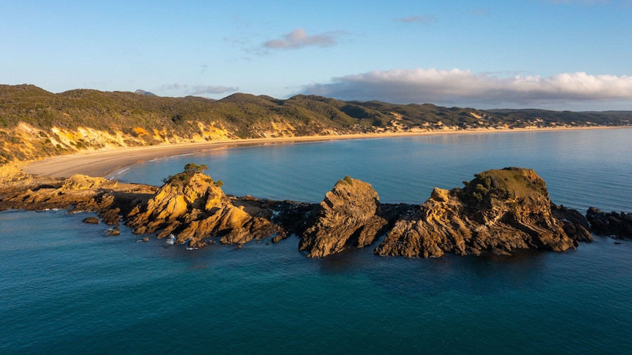 Byfield featuring rugged coastline, general coastal views and a sunset