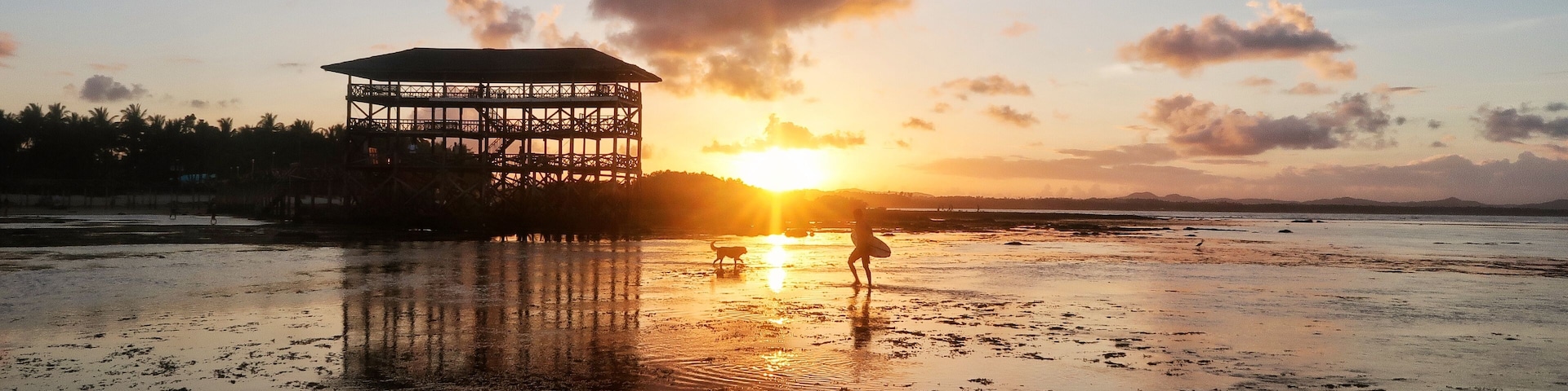 Stunning sunset at the iconic boardwalk @ Cloud 9 surfing spot in Siargao, the capital of surfing of the Philippines