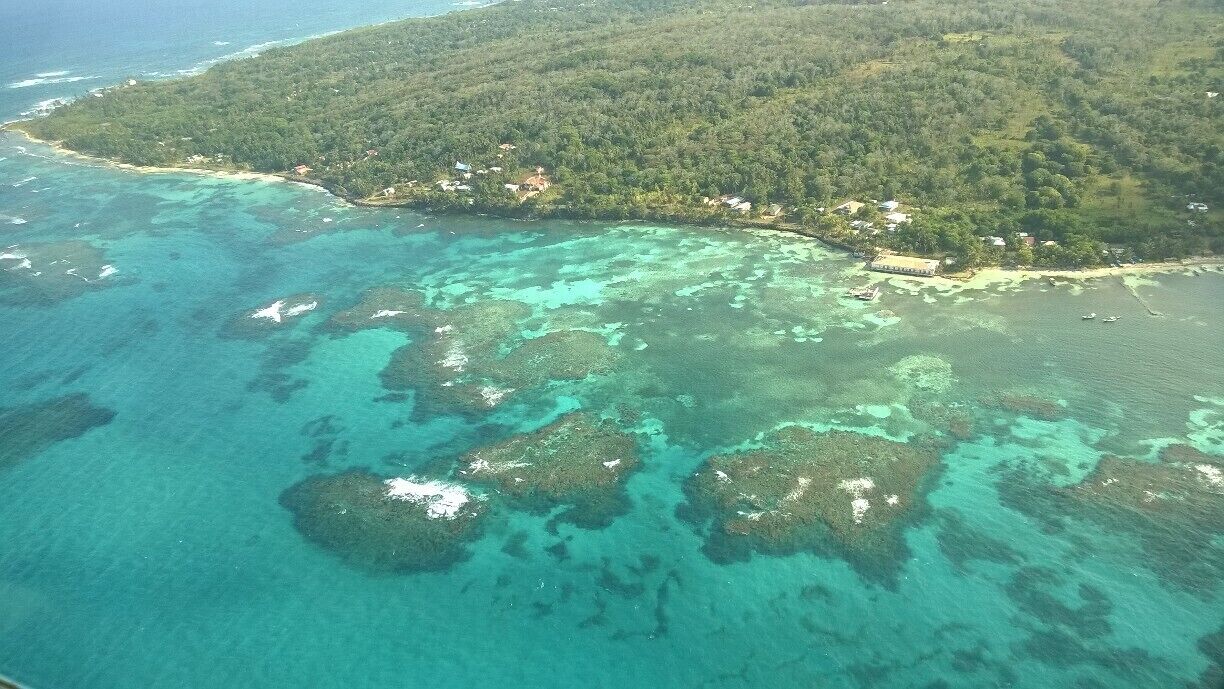 View of the gorgeous blue waters and reefs surrounding Big Corn Island from the air, as I left for the main land in a small 12 seater airplane. Sometimes the best views are from above! #beach 