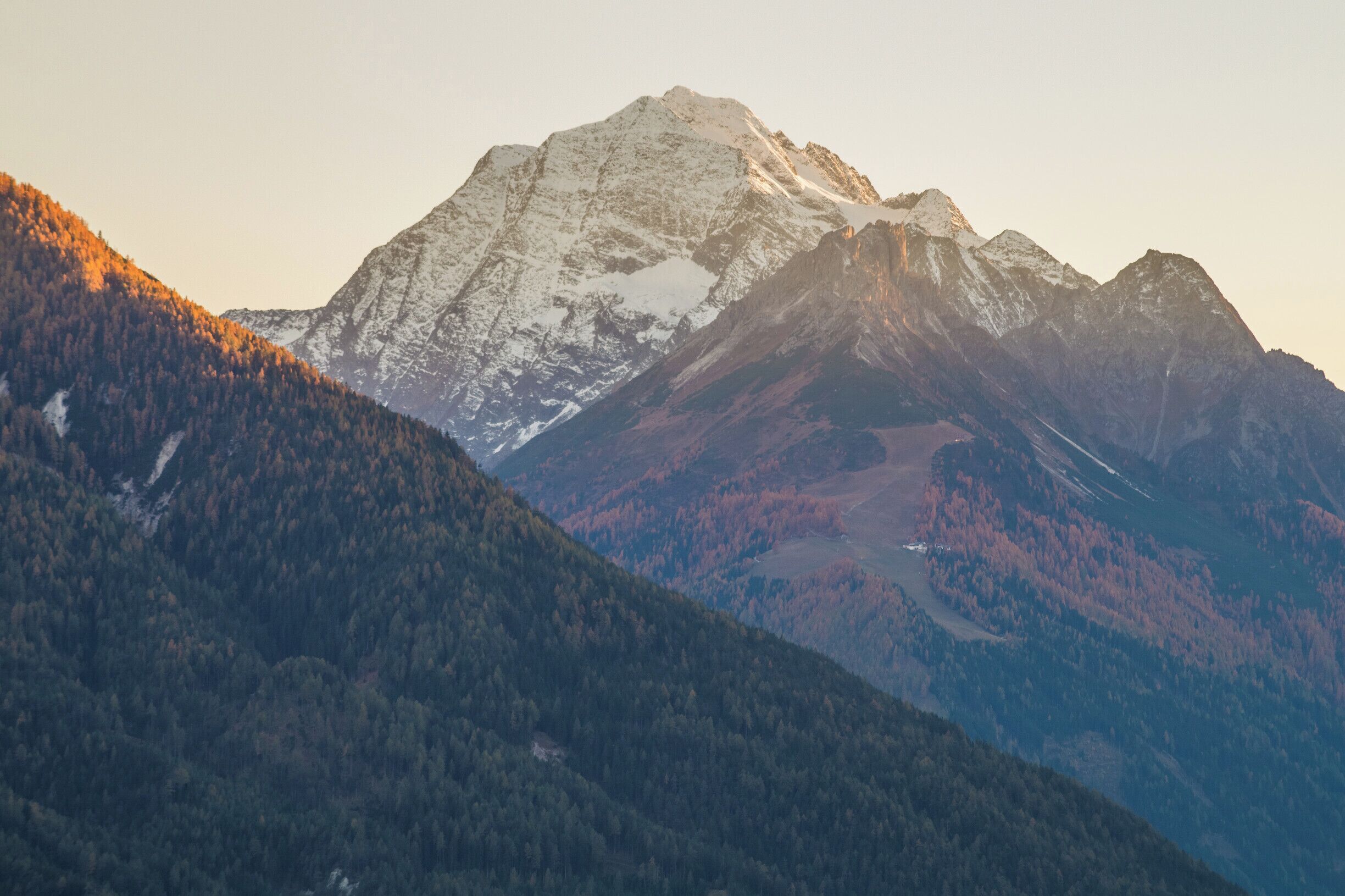 Warm sunset light hitting the snow kept mountains in the Alps. This is the view from Patsch to the 11er Ski resort.

#mountains #BvSMountains
