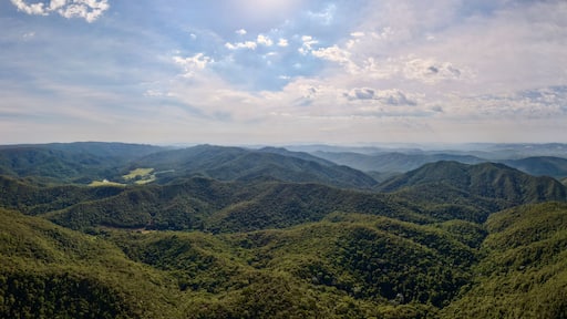 Misty morning landscape with fog over green hills in Cabreuva, Brazil