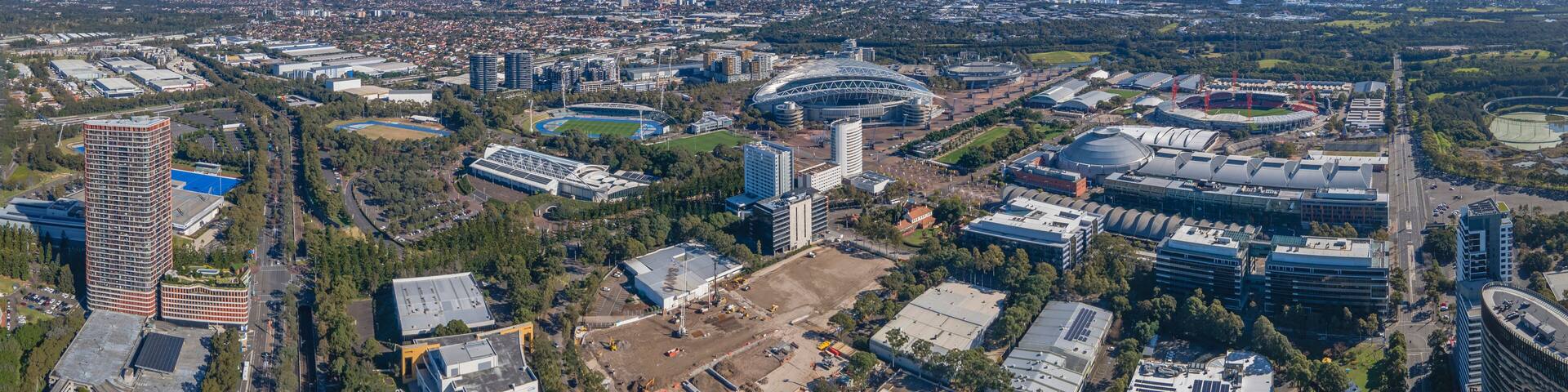 Panoramic aerial drone view of Sydney Olympic Park, an Inner West suburb of Sydney, NSW, Australia on a sunny day