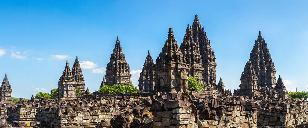 A temple complex with multiple tiered towers and ruins.