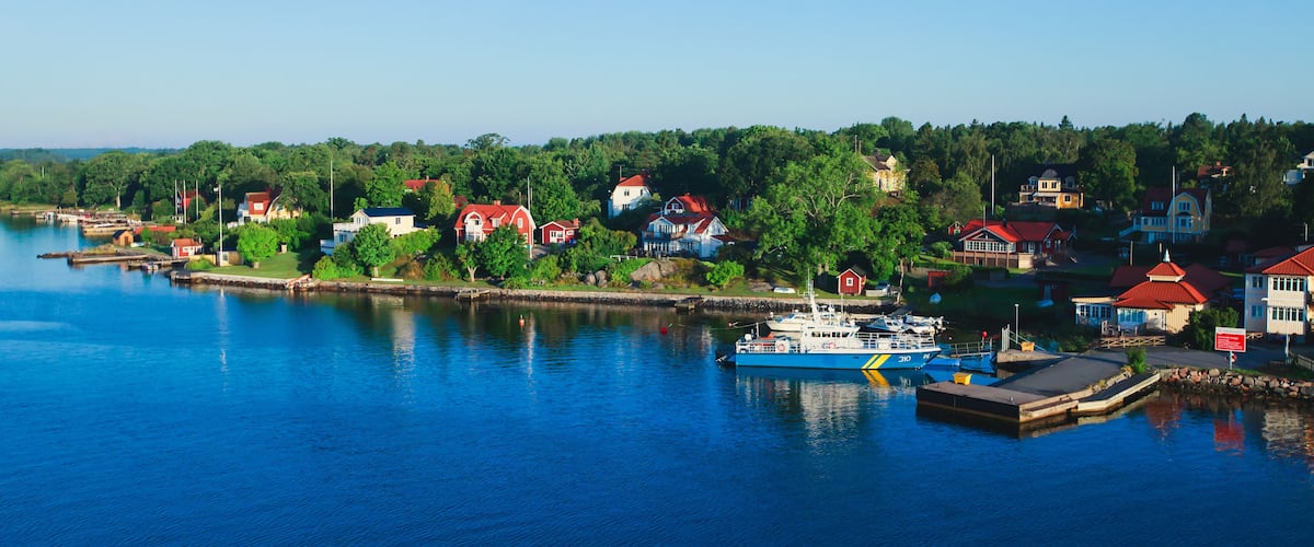 Beautiful super wide-angle panoramic aerial view of Stockholm archipelago, Sweden with harbor and skyline with scenery beyond the city, seen from the ferry, sunny summer day with blue sky