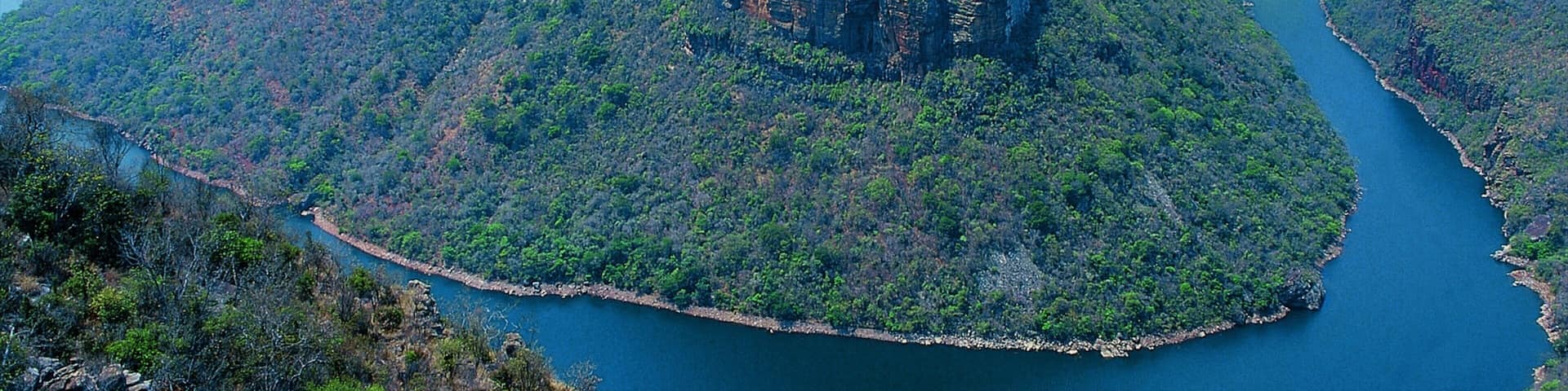Graskop which includes general coastal views, mountains and a river or creek