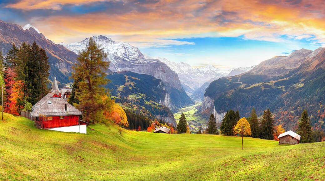 Scenic autumn view of picturesque alpine Wengen village and Lauterbrunnen Valley