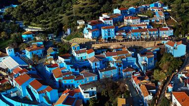 Aerial horizontal image of charming Júzcar village. Spain