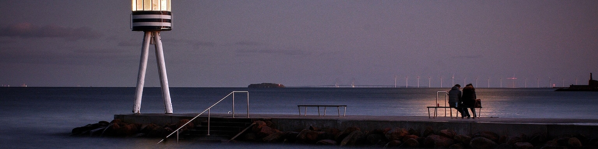 This nice beach is fantastic even in the moonlight. The old lifeguard tower, designed by the famous danish architect Arne Jacobsen, now shines beautiful almost like a lighthouse. Notice the lovers on the bench in the moonlight, sharing a perfect evening by the sea.
#culture #moonlight #beach #coastline