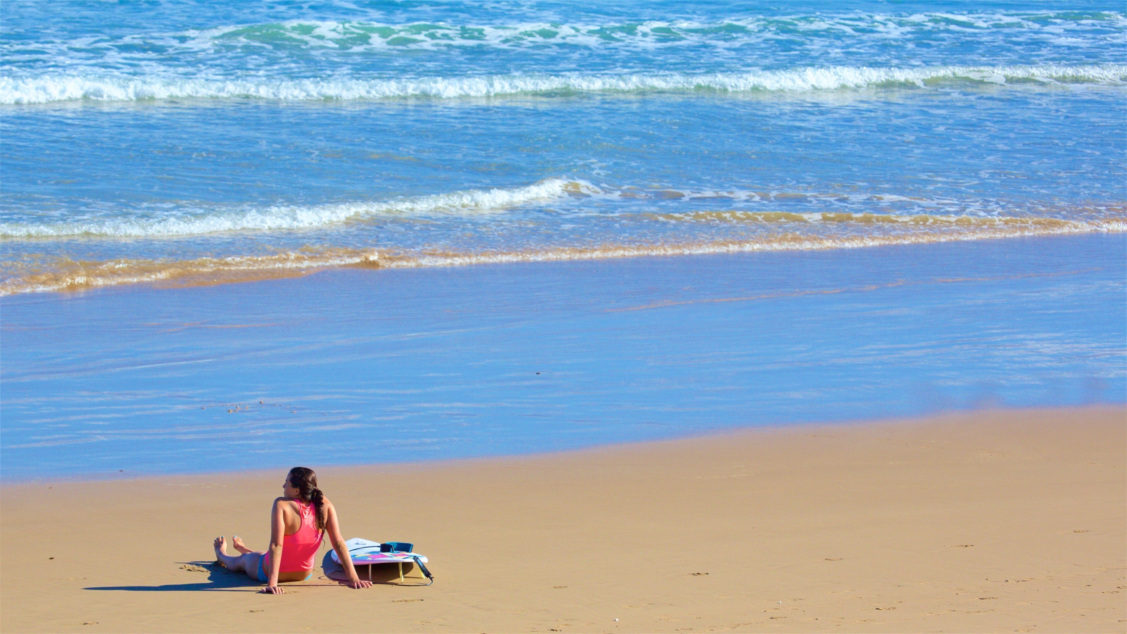 Great Ocean Road showing a sandy beach and general coastal views as well as an individual femail
