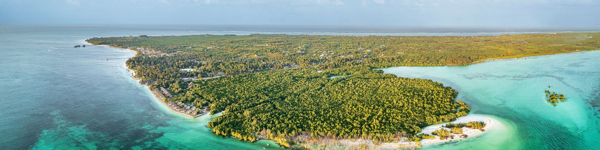 Sunset over lush mangrove forest washed by emerald green water of pristine lagoon, Pingwe, Chwaka Bay, Zanzibar, Tanzania