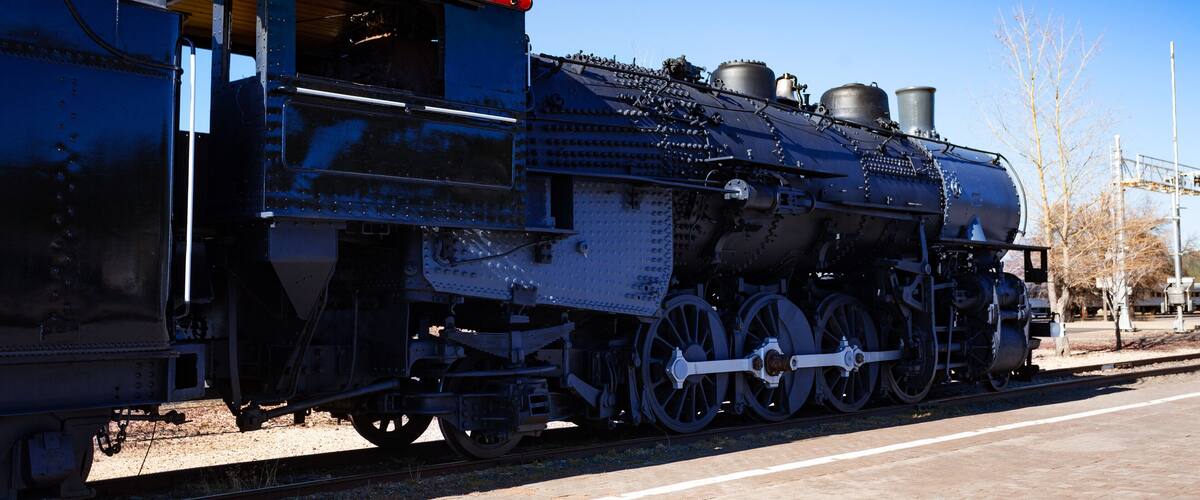 Close view of an old steam iron big locomotive on the station in Arizona, USA