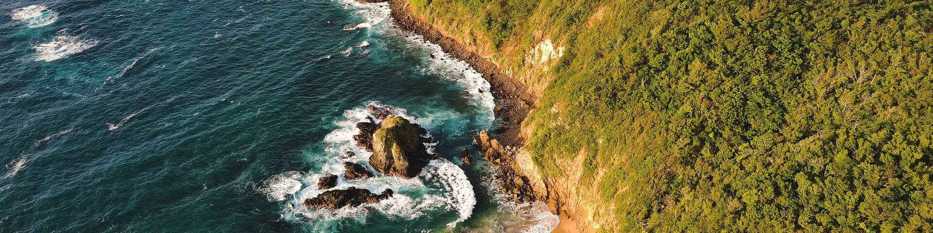 mazunte aerial cliff ocean view of punta cometa hiking path in ocean pacific coastline
