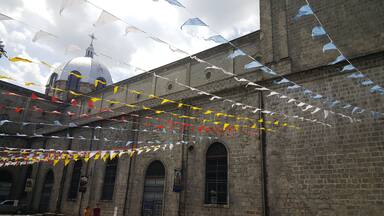 Colorfull flags at Santo Rosario church in Angeles, Philippines