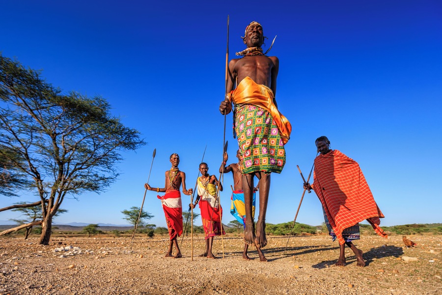 African warrior from Samburu tribe performing a traditional jumping dance, central Kenya. Samburu tribe is one of the biggest tribes of north-central Kenya, and they are related to the Maasai.