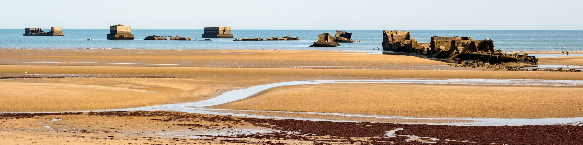 Panoramic view of the remains of Phoenix caissons in Asnelles, France, used to build the artificial Mulberry harbour on Gold Beach after the Normandy landings in World War II.
