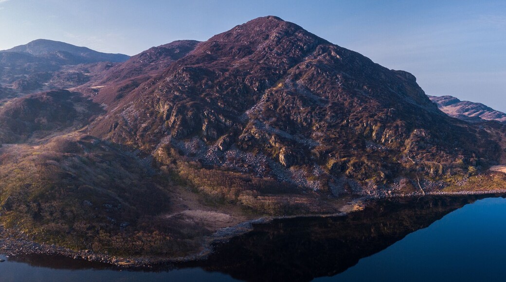 Aerial drone panorama of Llyn Cwm Bychan - a mountain lake in north Wales part of the Rhinogydd mountains in the Snowdonia National Park