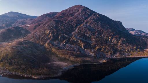 Aerial drone panorama of Llyn Cwm Bychan - a mountain lake in north Wales part of the Rhinogydd mountains in the Snowdonia National Park