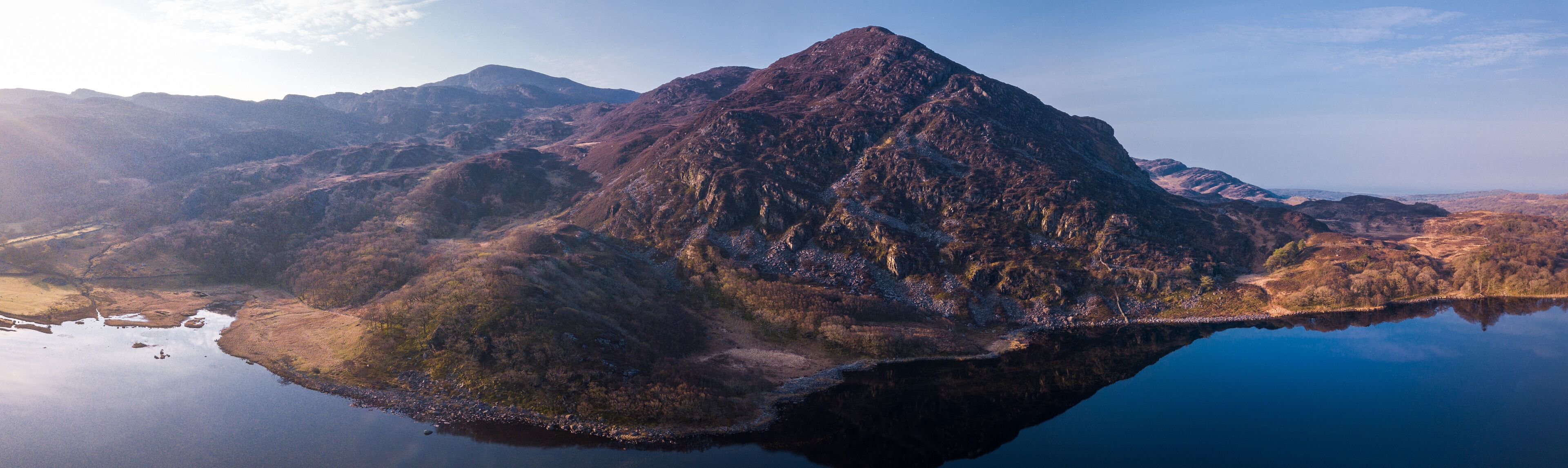 A mountain range with a lake reflecting the peaks.