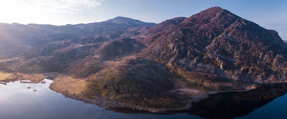 A mountain range with a lake reflecting the peaks.