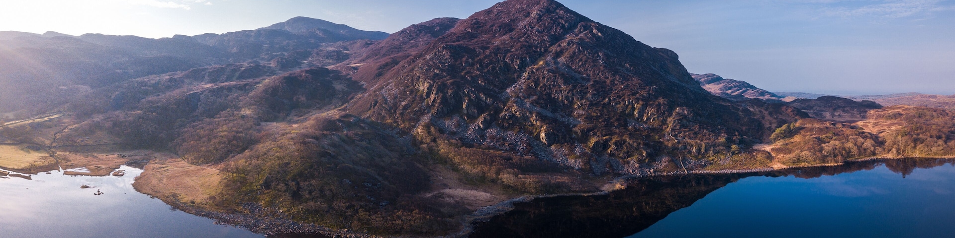 A mountain range with a lake reflecting the peaks.