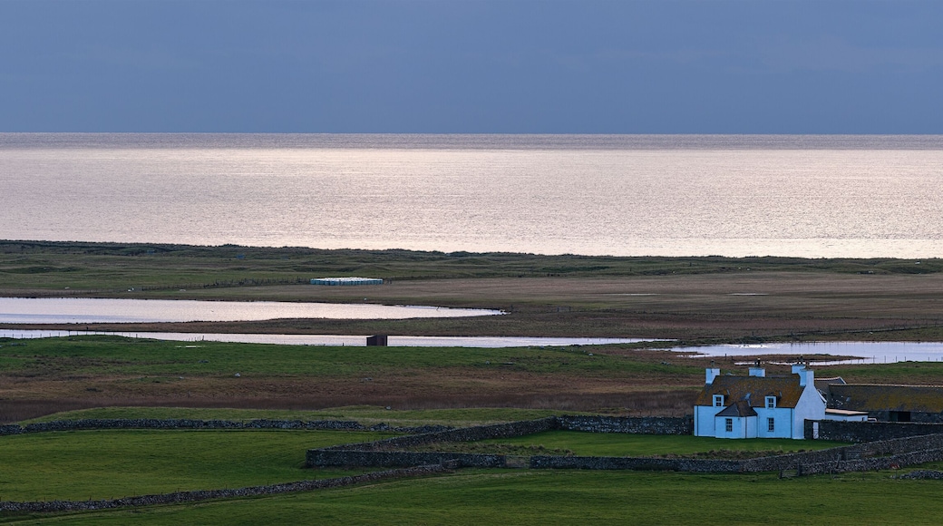 Small cottage in the distance on South Uist, Outer Hebrides, Scotland, UK