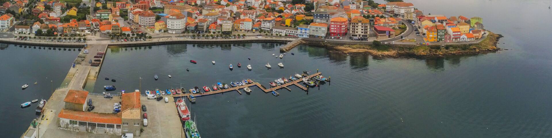 Aerial view in Camarinas. Galicia. Coastal town with boats in Spain