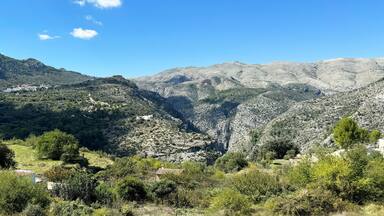 Panoramic view of the Hell's Ravine, or El Barranc de l'Infern, in La Vall de Laguar. One of the hardest hiking routes in Spain. The Cavall Verd mountain and the town Benimaurell are in the background
