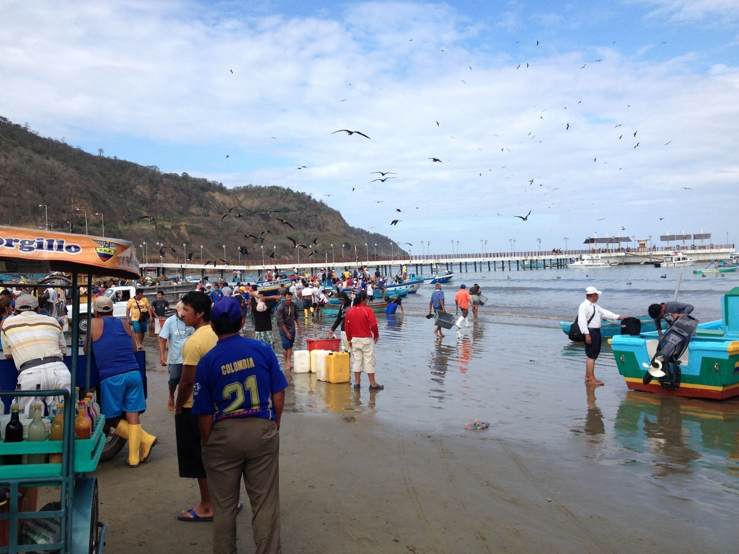 Birds and people alike gather for the fresh catch of the day along the beach in Puerto Lopez. Although the market is open daily, Saturday morning is the busiest day. Many of the local town restaurants get the day's supply of fish and other seafood from this market, and it's easy to recognize the freshness when you eat it. Come hungry to the market and you can ask the vendors to fix your choice of the catches there for you. #market