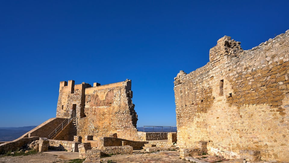 Ancient stone ruins with a clear blue sky.