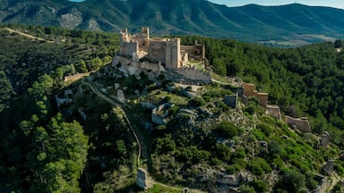 Aerial panorama view of Alcala de Xivert (Alcalá de Chivert) medieval Templar knight castle ruins in Valencia province Spain